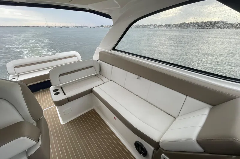 Slide: The Image of Luxurious interior of 2017 Regal 35 Sport Coupe yacht with comfortable seating and scenic water view. - 20