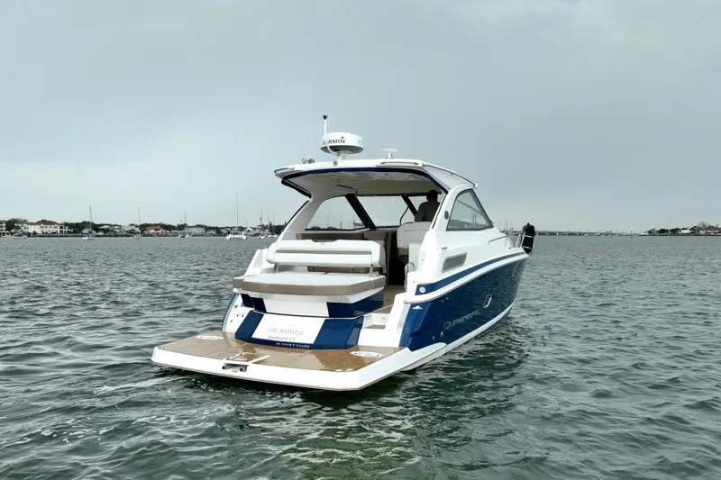 Slide: The Image of 2017 Regal 35 Sport Coupe boat on calm water, rear view. - 5