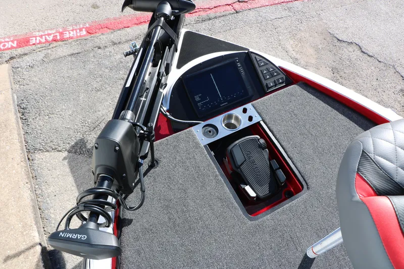 Slide: The Image of 2025 Caymas CX 20 PRO boat dashboard with Garmin electronics and foot pedal controls. - 25