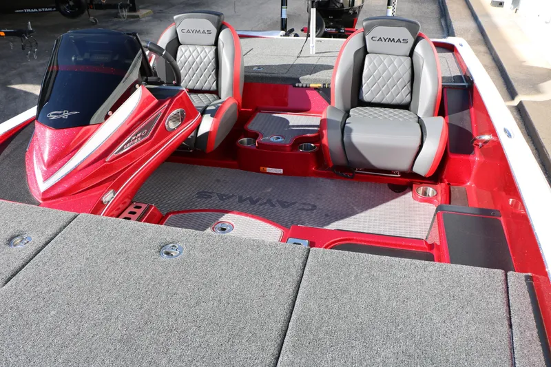 Slide: The Image of 2025 Caymas CX 20 PRO boat interior with red accents and gray seating. - 29