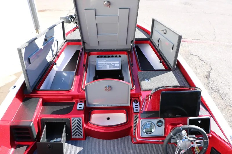 Slide: The Image of 2025 Caymas CX 20 PRO boat interior with open storage compartments and modern dashboard. - 31
