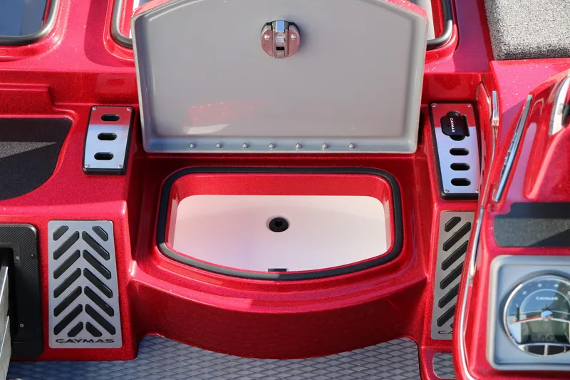 Slide: The Image of 2025 Caymas CX 20 PRO boat interior with open storage compartment, red finish, and sleek design. - 33