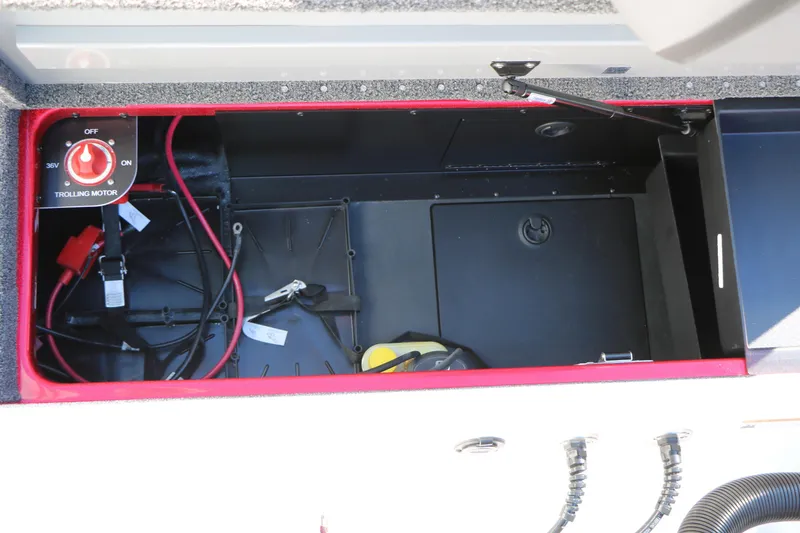 Slide: The Image of 2025 Caymas CX 20 PRO boat storage compartment with trolling motor switch and wiring. - 37