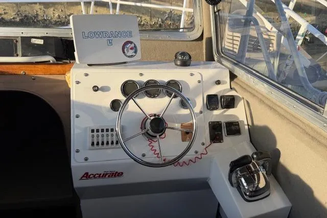 Slide: The Image of 2007 ACB Aluminum Chambered Boats Sportfisher with open storage compartment on deck. - 11