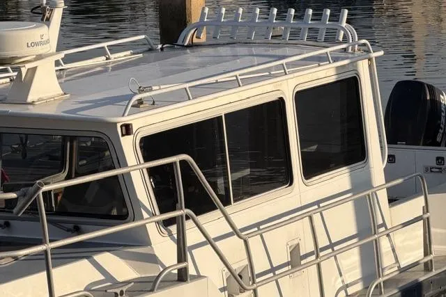 Slide: The Image of Bow of 2007 ACB Sportfisher boat with anchor chain and railing. - 4