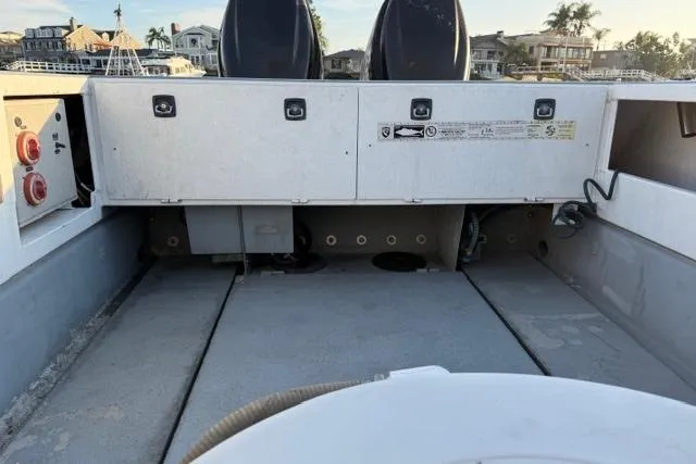 Slide: The Image of 2007 ACB Aluminum Chambered Boats Sportfisher docked, featuring a white exterior and palm trees in the background. - 5