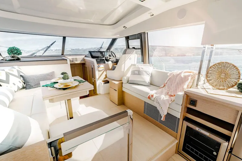 Slide: The Image of Manufacturer Provided Image: Luxurious interior of 2023 Prestige 420 S yacht with modern furnishings and panoramic windows. - 12