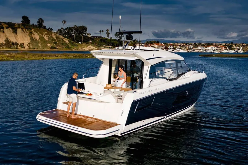 Slide: The Image of Manufacturer Provided Image: 2023 Prestige 420 S yacht cruising on a scenic waterway. - 4