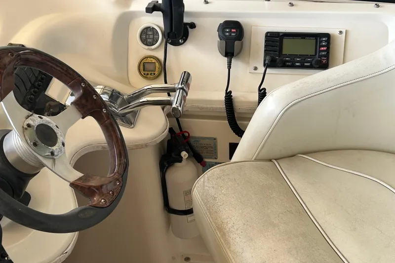 Slide: The Image of Steering area of 2000 Cruisers Yachts 3750 Motoryacht with controls and radio equipment. - 24