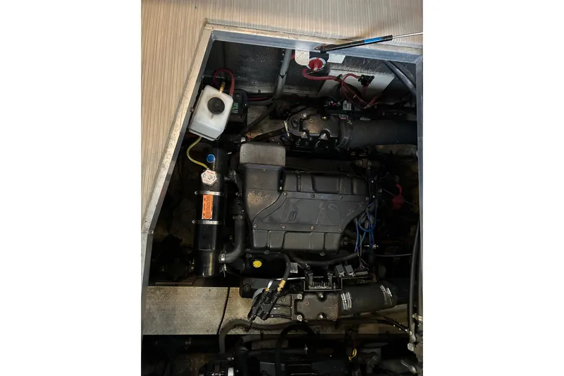 Slide: The Image of Engine compartment of 2000 Cruisers Yachts 3750 Motoryacht, showcasing mechanical components. - 10