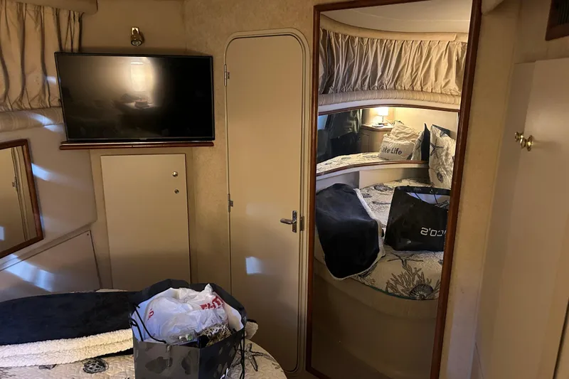 Slide: The Image of Interior of 2000 Cruisers Yachts 3750 Motoryacht with TV and cozy bedroom. - 18