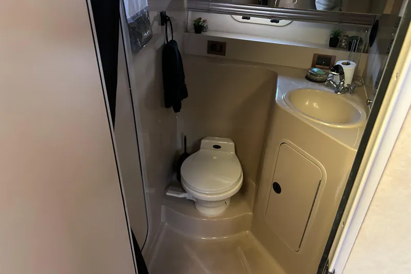 Slide: The Image of Bathroom interior of 2000 Cruisers Yachts 3750 Motoryacht, featuring toilet and sink. - 21