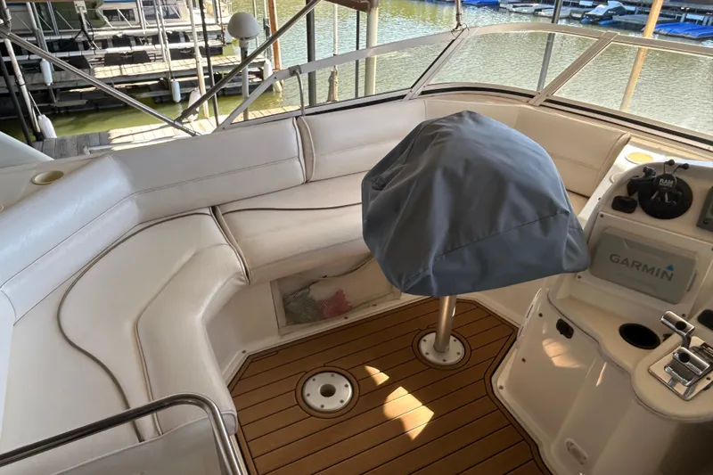Slide: The Image of 2000 Cruisers Yachts 3750 Motoryacht cockpit with seating and Garmin navigation system. - 26