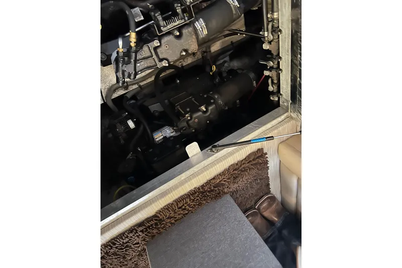 Slide: The Image of Engine compartment of a 2000 Cruisers Yachts 3750 Motoryacht, showing mechanical components. - 9