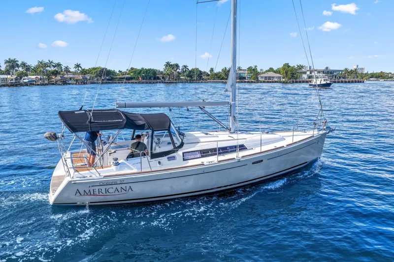 Slide: The Image of 2014 Beneteau Oceanis 37 sailboat "Americana" cruising on a sunny day. - 10