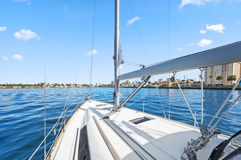 Slide: The Image of Beneteau Oceanis 37 sailboat on calm waters, 2014 model, clear blue sky. - 13