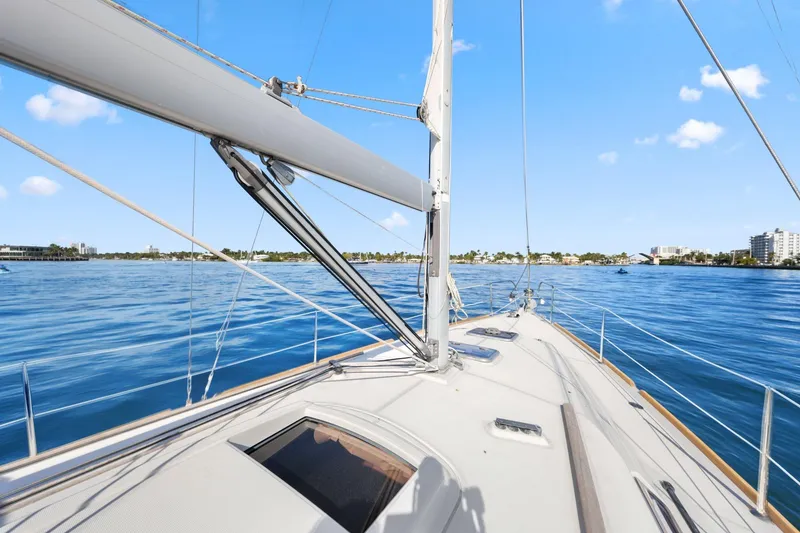 Slide: The Image of Sailing on a 2014 Beneteau Oceanis 37 yacht in calm blue waters under a clear sky. - 15