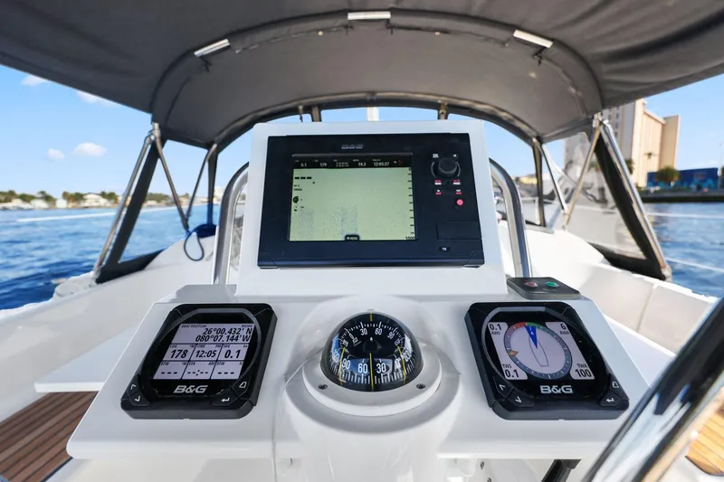 Slide: The Image of Cockpit of 2014 Beneteau Oceanis 37 sailboat with navigation instruments and compass. - 19