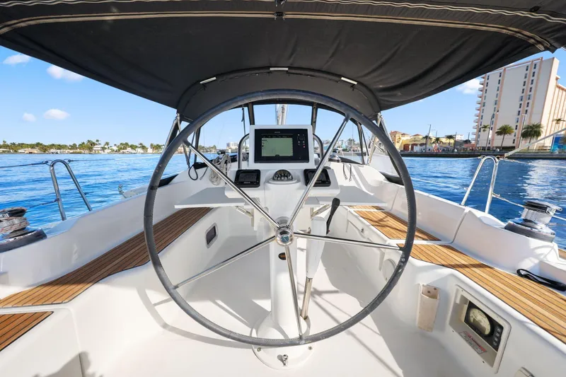 Slide: The Image of Cockpit view of 2014 Beneteau Oceanis 37 sailboat with steering wheel and navigation system. - 20