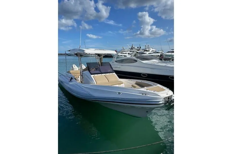 Slide: The Image of 2022 Zar Formenti 85 boat docked in a marina under a blue sky. - 10