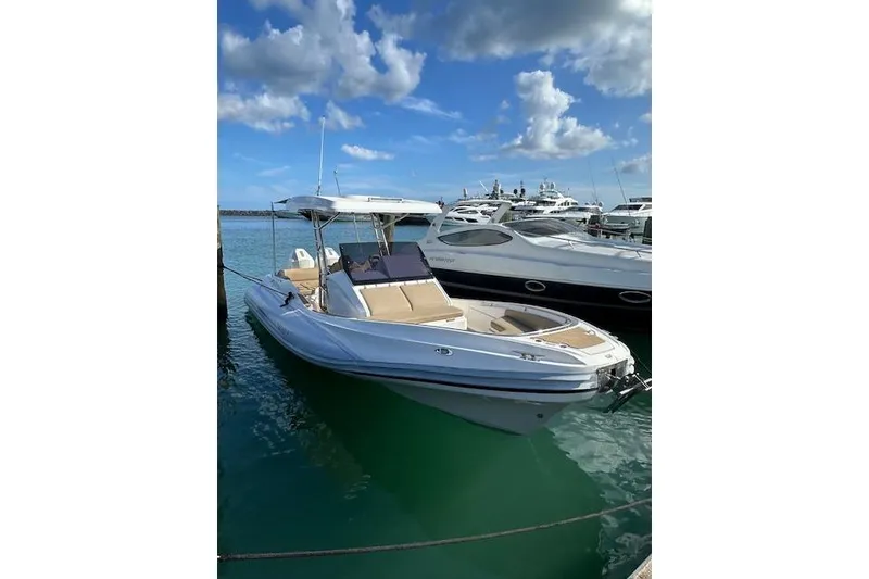 Slide: The Image of 2022 Zar Formenti 85 boat docked in marina under blue sky. - 11