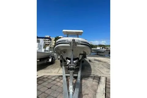 Slide: The Image of 2022 Zar Formenti 85 boat on trailer, parked outdoors under clear blue sky. - 14