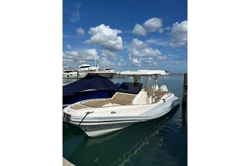 Slide: The Image of Zar Formenti 85 boat, 2022 model, docked in a marina under a blue sky. - 3