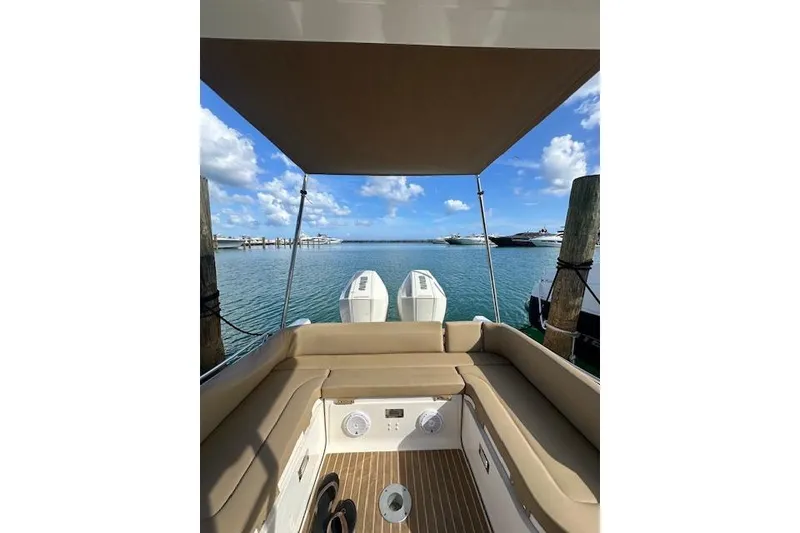 Slide: The Image of Zar Formenti 85 boat, 2022 model, docked with scenic ocean view and clear blue sky. - 7