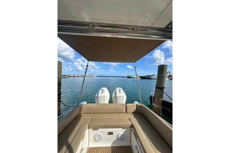 Slide: The Image of Zar Formenti 85 boat, 2022 model, docked with scenic ocean view. - 8