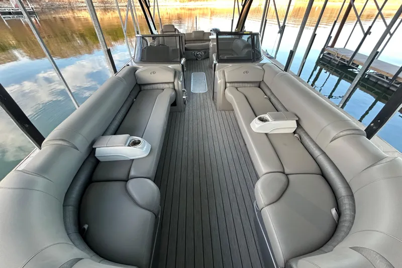 Slide: The Image of 2020 Avalon 2785 Excaliber pontoon boat interior with luxurious seating and sleek design. - 12