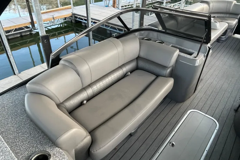 Slide: The Image of 2020 Avalon 2785 Excaliber boat interior with gray seating and sleek design. - 14