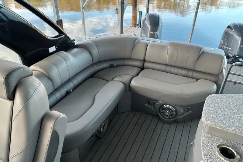 Slide: The Image of Luxurious seating on 2020 Avalon 2785 Excaliber pontoon boat, featuring sleek gray upholstery. - 9