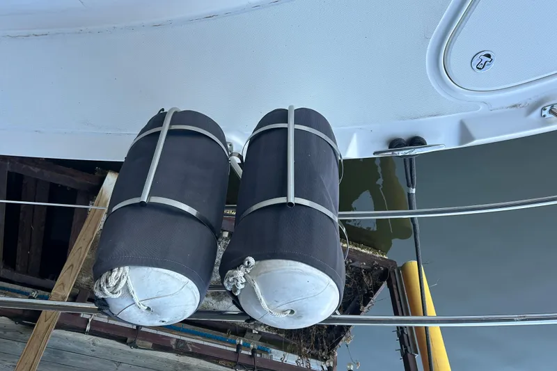 Slide: The Image of 2005 Sea Ray 44 Sedan Bridge with dock fenders for protection. - 19