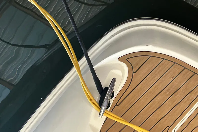 Slide: The Image of 2005 Sea Ray 44 Sedan Bridge deck with cleat and ropes. - 22