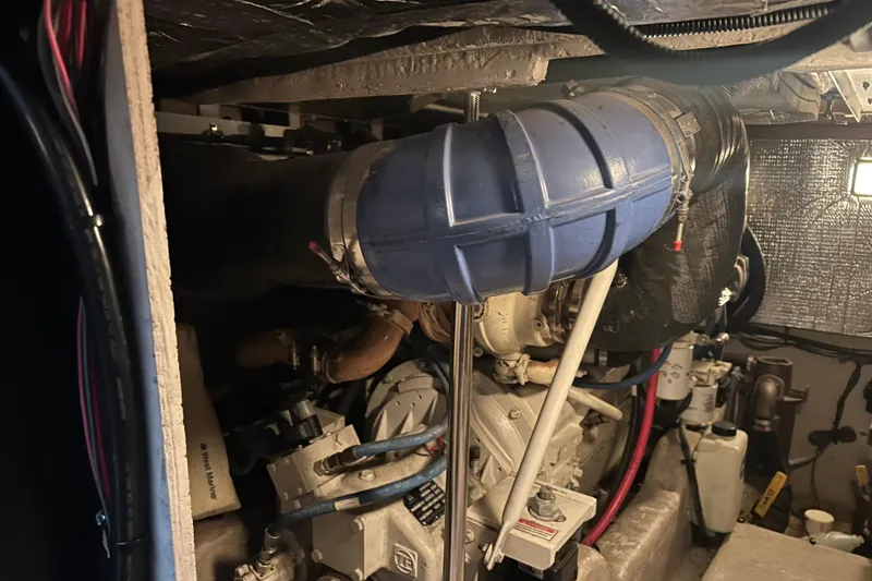 Slide: The Image of Engine room of a 2005 Sea Ray 44 Sedan Bridge yacht, featuring mechanical components. - 34