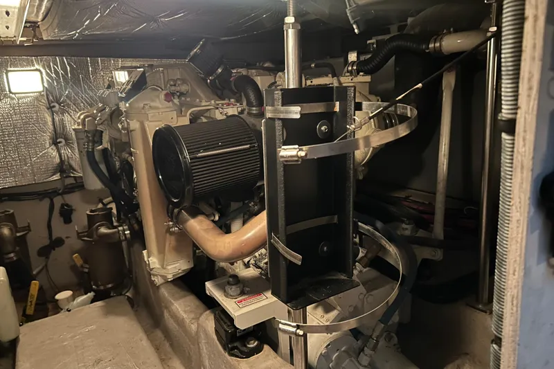 Slide: The Image of Engine room of a 2005 Sea Ray 44 Sedan Bridge yacht, showcasing mechanical components. - 35