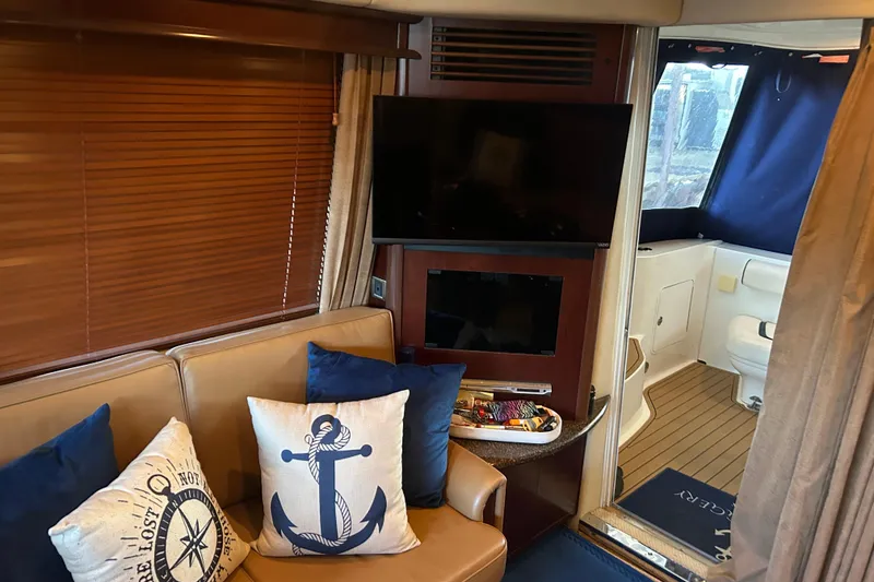 Slide: The Image of Interior of 2005 Sea Ray 44 Sedan Bridge with nautical-themed decor and modern amenities. - 38