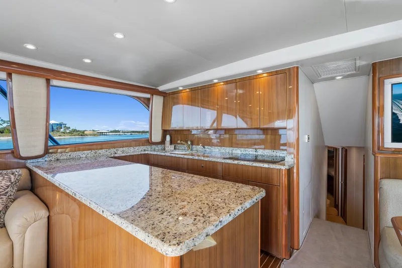 Slide: The Image of Luxurious interior of 2007 Viking 56 Convertible yacht with granite countertops and wood cabinetry. - 16