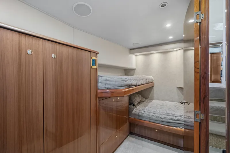 Slide: The Image of Interior cabin of 2007 Viking 56 Convertible yacht with wooden bunk beds. - 18