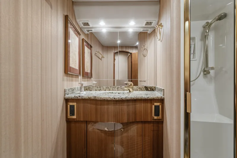 Slide: The Image of Luxurious bathroom in 2007 Viking 56 Convertible yacht with granite countertop and shower. - 22
