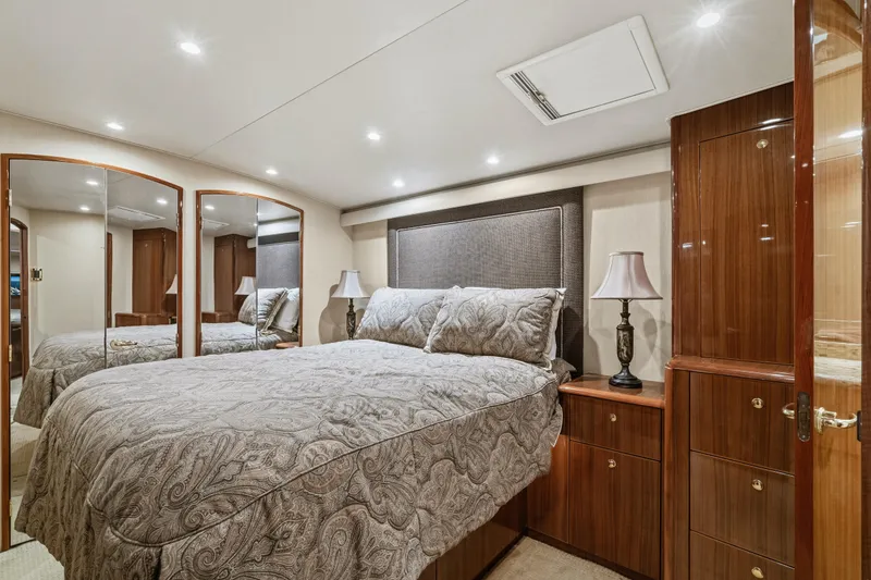Slide: The Image of Luxurious bedroom interior of 2007 Viking 56 Convertible yacht with elegant wood finishes. - 28