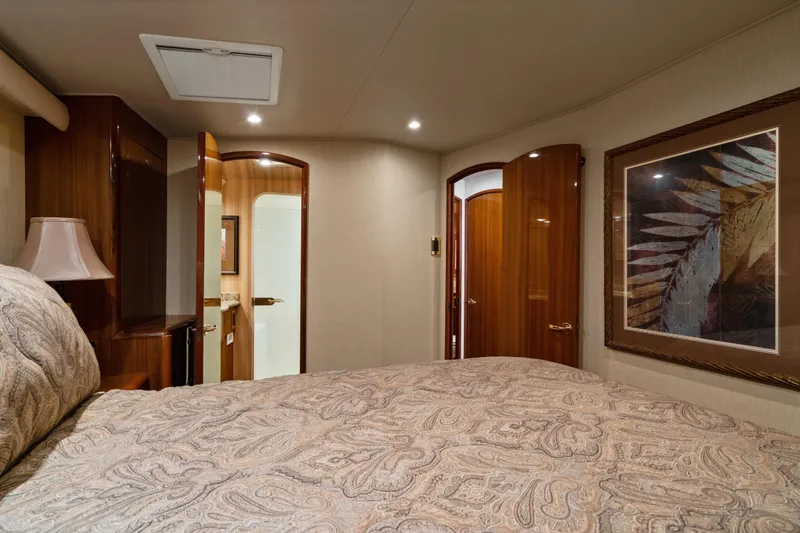 Slide: The Image of Luxurious bedroom interior of 2007 Viking 56 Convertible yacht with elegant decor and artwork. - 31