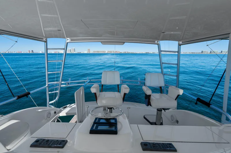 Slide: The Image of 2007 Viking 56 Convertible yacht interior with ocean view and modern seating. - 39