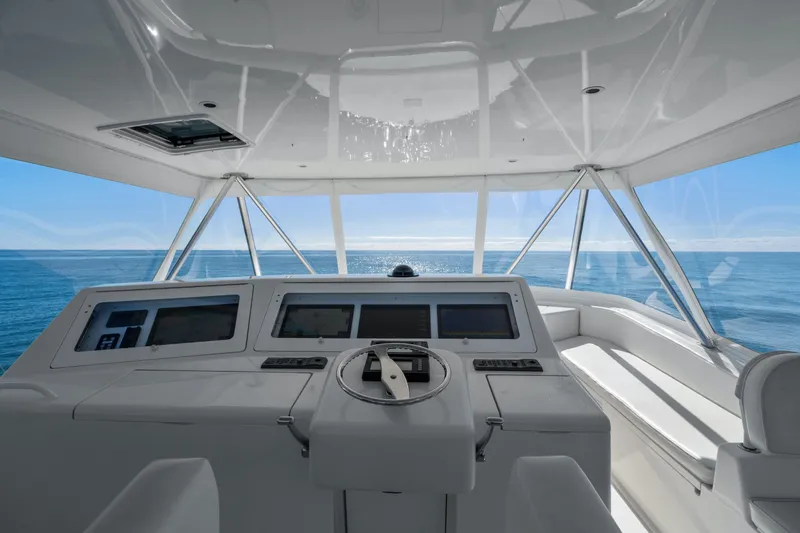 Slide: The Image of Helm of 2007 Viking 56 Convertible yacht with ocean view. - 42