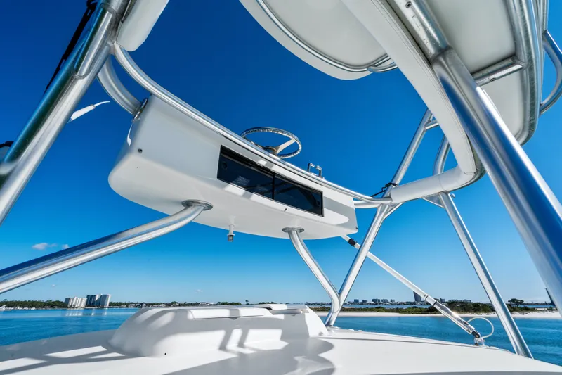 Slide: The Image of 2007 Viking 56 Convertible yacht tower against clear blue sky. - 48