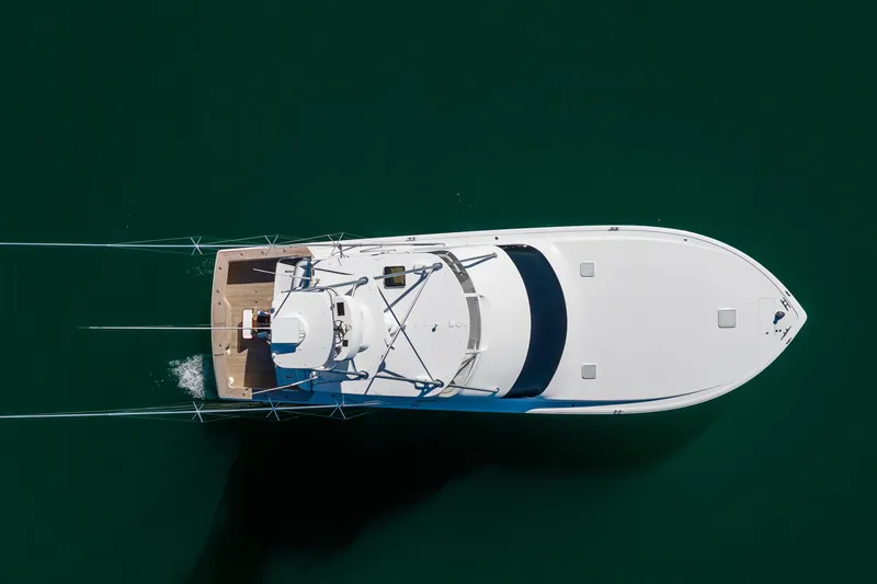 Slide: The Image of Aerial view of 2007 Viking 56 Convertible yacht on calm green water. - 6