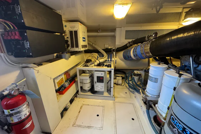 Slide: The Image of Engine room of 2007 Viking 56 Convertible yacht with equipment and machinery. - 66