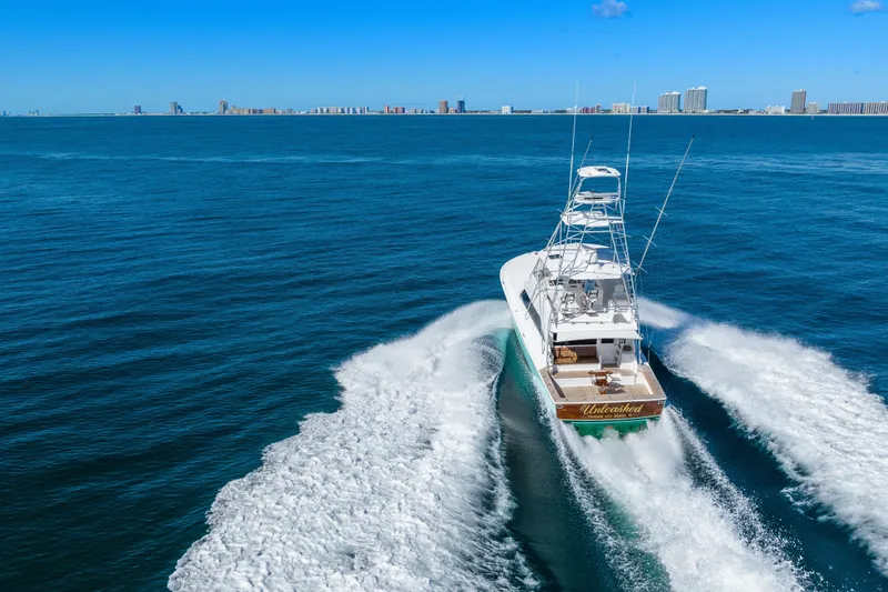 Slide: The Image of 2007 Viking 56 Convertible yacht cruising on open blue ocean. - 7