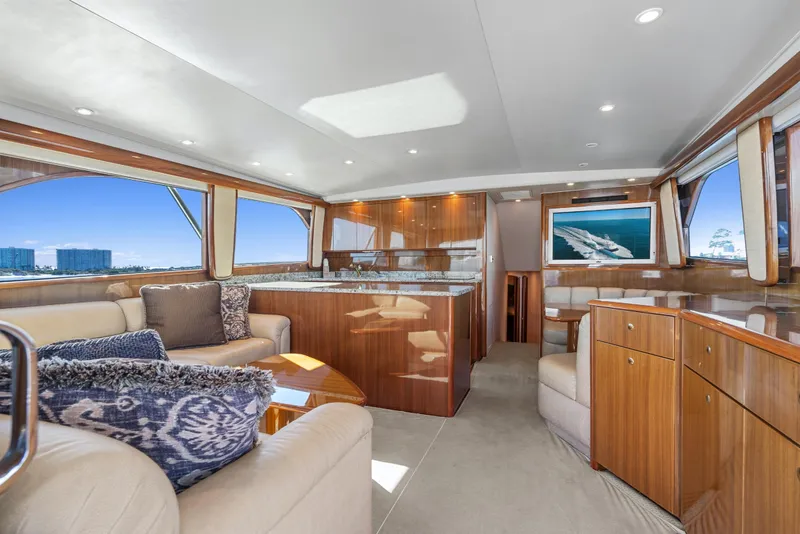 Slide: The Image of Luxurious interior of 2007 Viking 56 Convertible yacht with elegant wood finishes and plush seating. - 8
