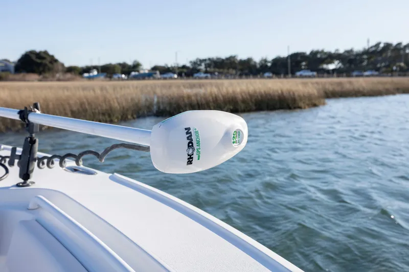 Slide: The Image of 2021 Sea Hunt Ultra 265 SE with Rhodan trolling motor on calm water. - 12